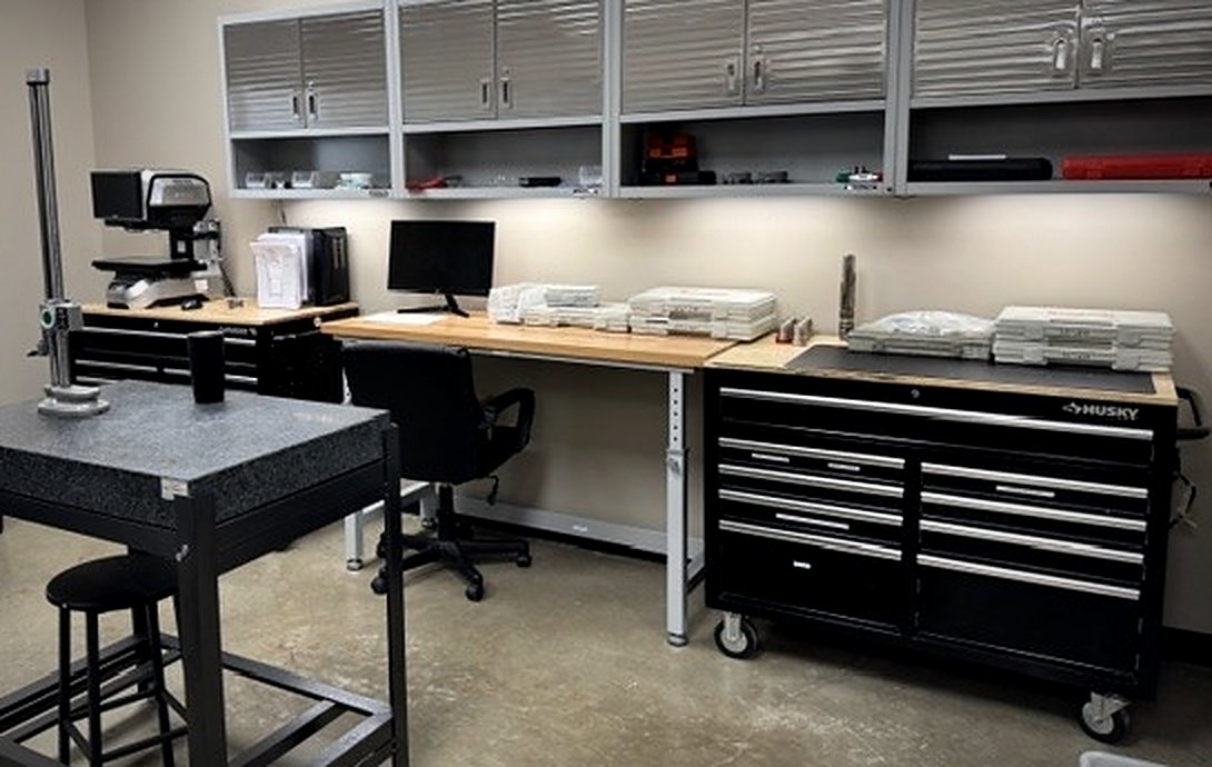 Inspection room with granite surface plate, height gauge, and measurement equipment
