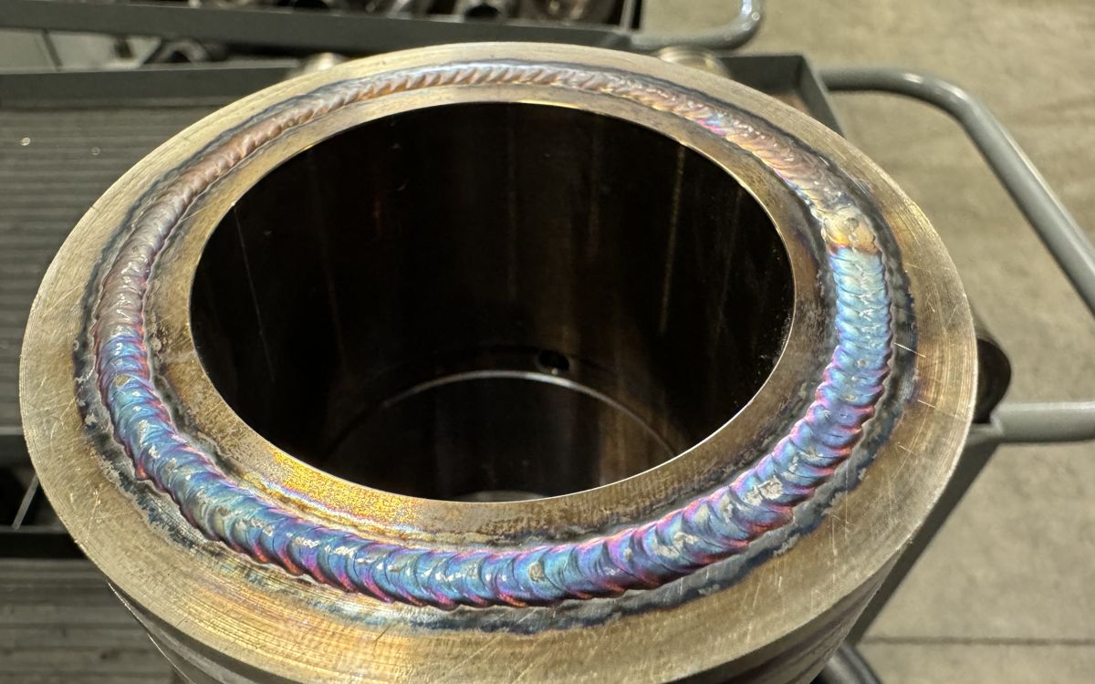 Bottom face of a muleshoe sleeve built up by welding